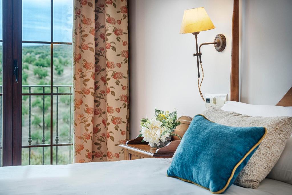 Кровать или кровати в номере Hotel Rural Cazorla Posada del Cordobés