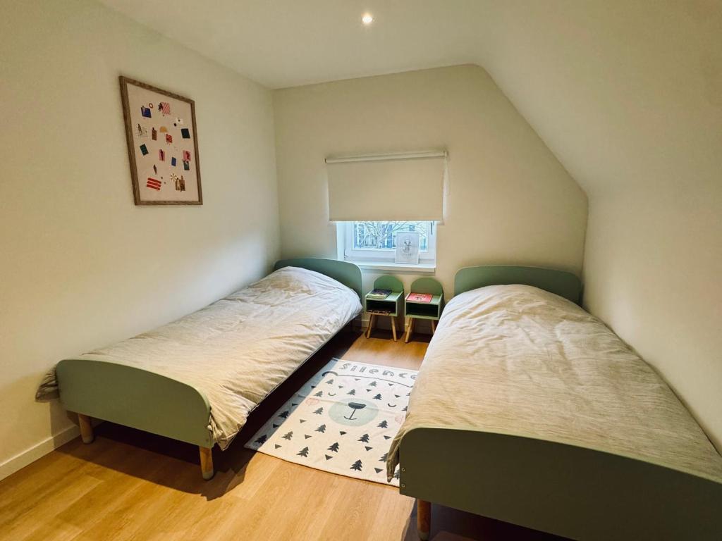 Ένα ή περισσότερα κρεβάτια σε δωμάτιο στο Villa Oni met grote speelruimte