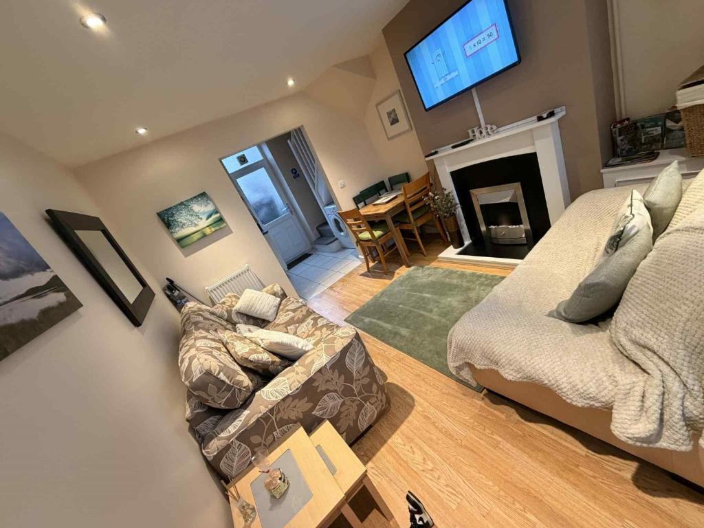 Кровать или кровати в номере Hill View Cottage