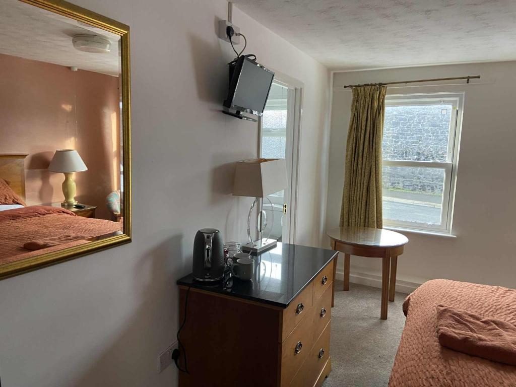 Ένα ή περισσότερα κρεβάτια σε δωμάτιο στο Shipwright Inn