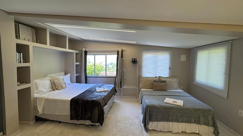 En eller flere senge i et værelse på Boutique House - Ilha Grande