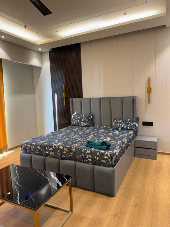 a bedroom with a bed in a room at Galaxy blue sapphire plaza in Ghaziabad