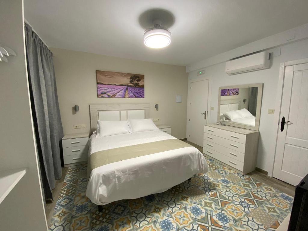 Ένα ή περισσότερα κρεβάτια σε δωμάτιο στο Hostal el Ciervo