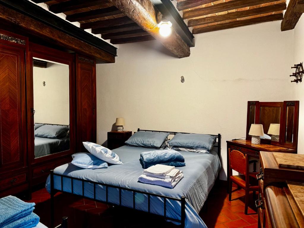 En eller flere senge i et værelse på Appartamento Kira