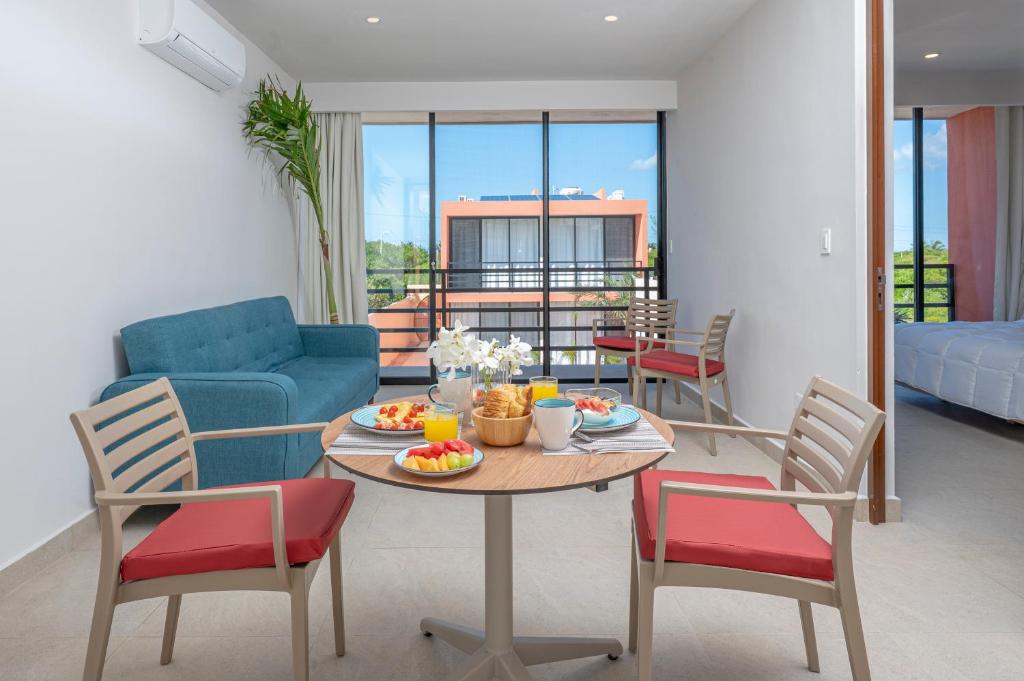 a living room with a table and chairs at The Retreat at Sisal in Sisal