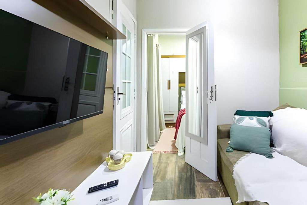 Giường trong phòng chung tại Casa Aconchegante