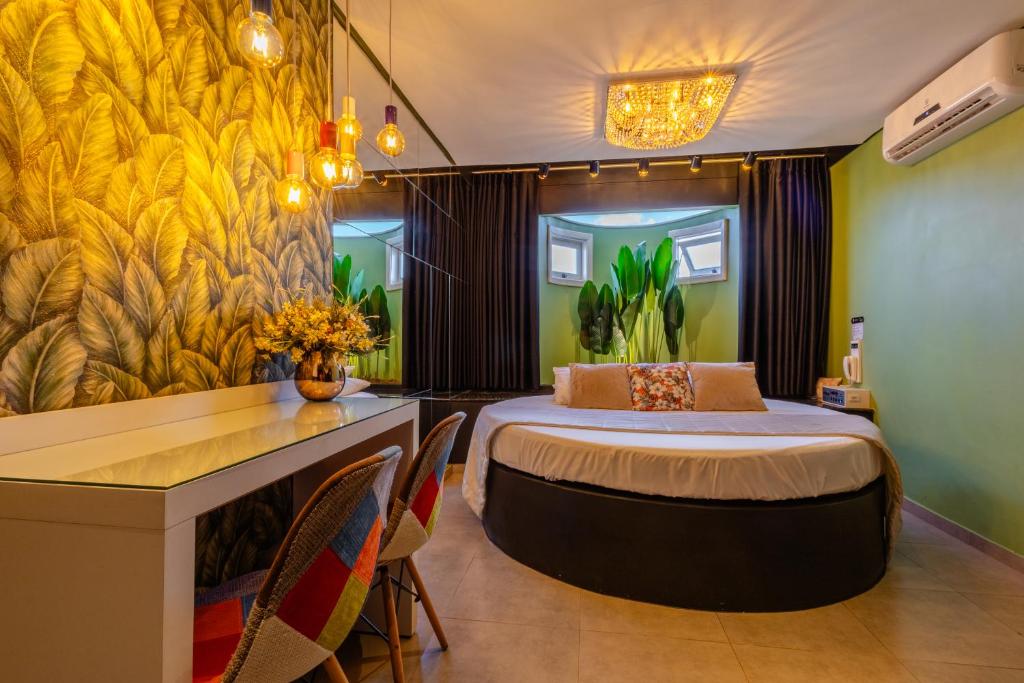 Ένα ή περισσότερα κρεβάτια σε δωμάτιο στο Hotel Motel Paradiso - Cruz Alta-RS