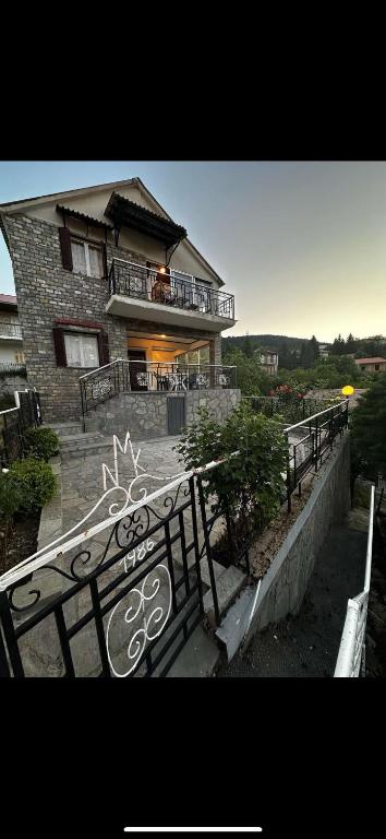 a house with a gate in front of it at Kokkotis Residence in Samarina