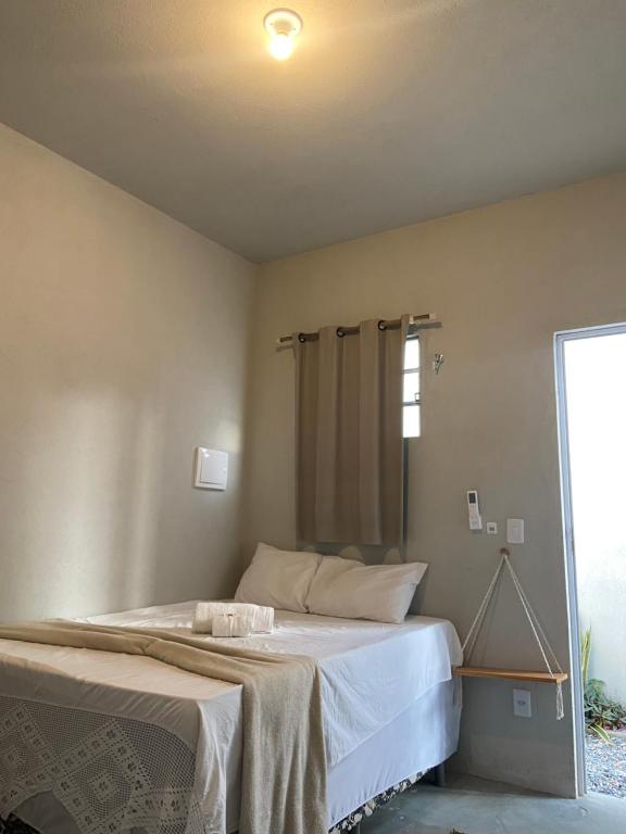 Postel nebo postele na pokoji v ubytování Aratu Pousada