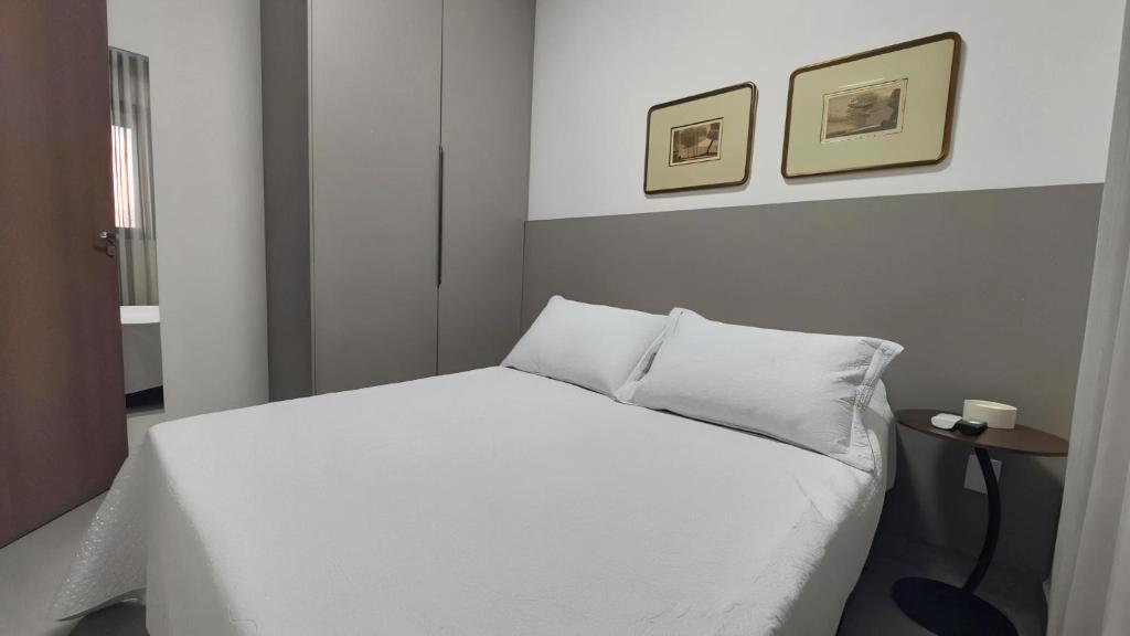 Una cama o camas en una habitación de Studio Garden - ideal para relaxar ou trabalhar