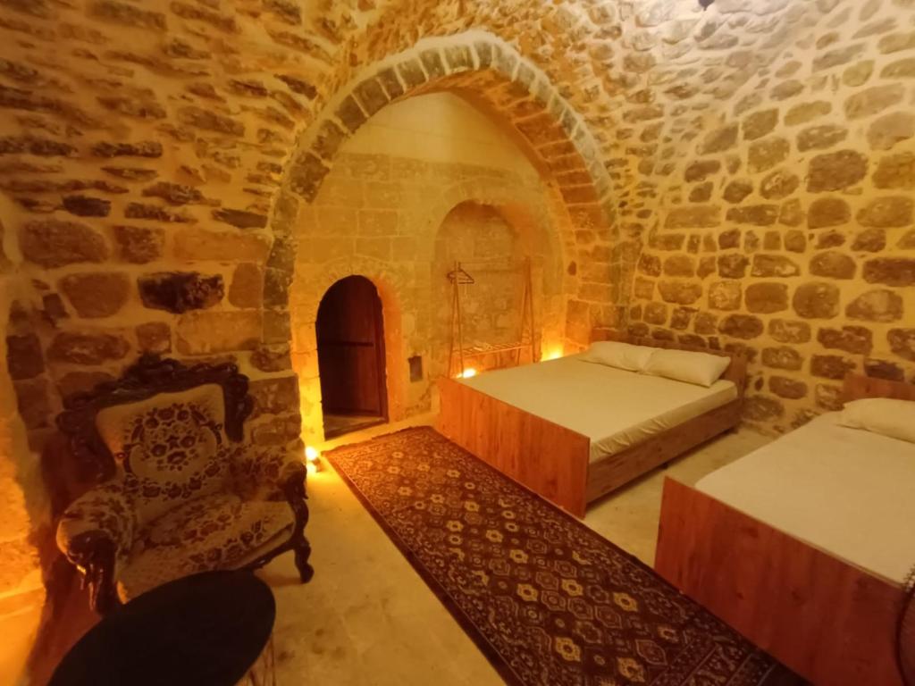 Ένα ή περισσότερα κρεβάτια σε δωμάτιο στο Yeşil periy konaği butik otel