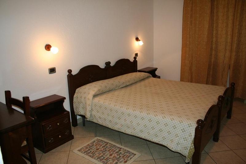 Postel nebo postele na pokoji v ubytování Hotel Beau Sejour