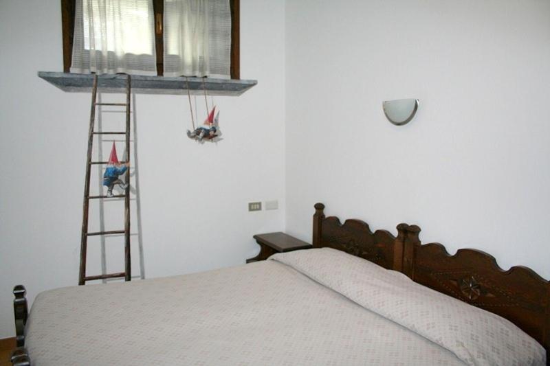Postel nebo postele na pokoji v ubytování Hotel Beau Sejour
