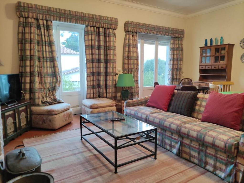 a living room with a couch and a coffee table at Classic 3BR Sintra Home near Beaches & Palaces in Colares