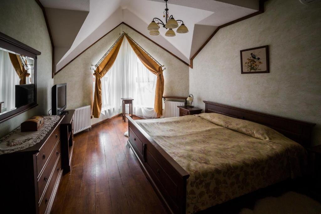 Postel nebo postele na pokoji v ubytování Gnizdo Golubky
