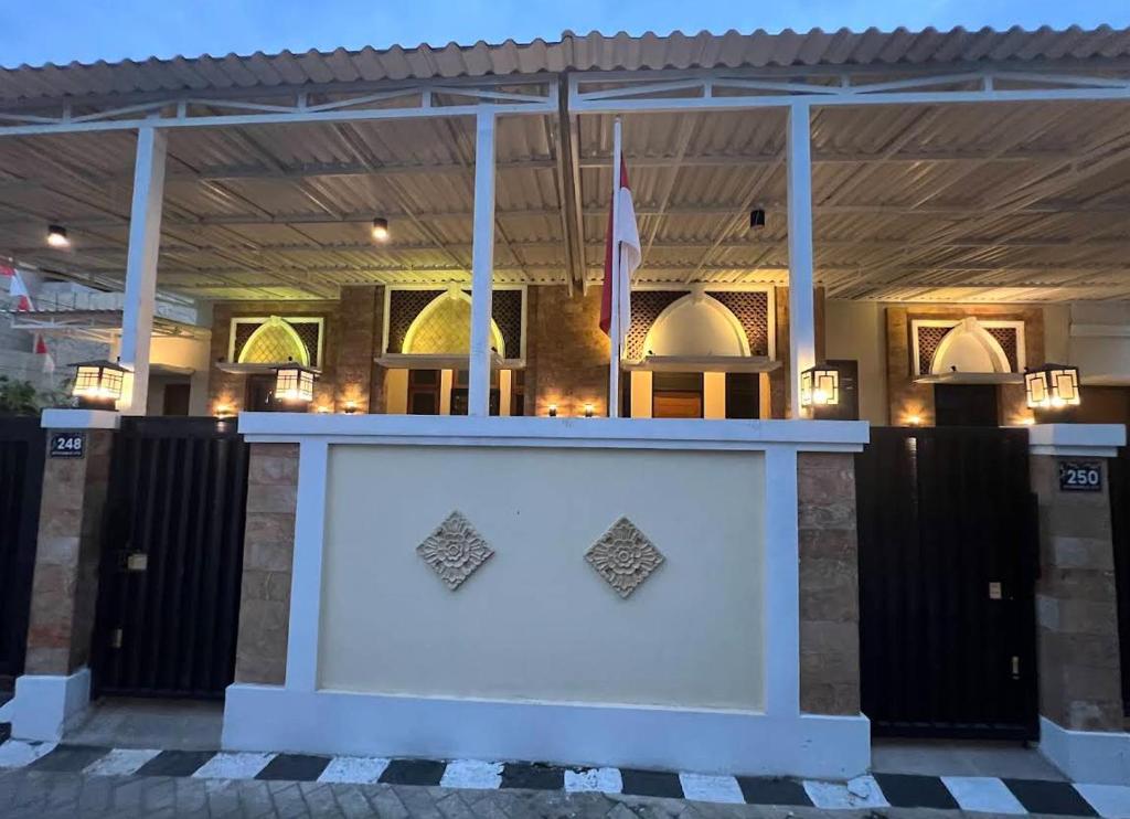 a white counter in front of a building at Tentrem Madani in Yogyakarta