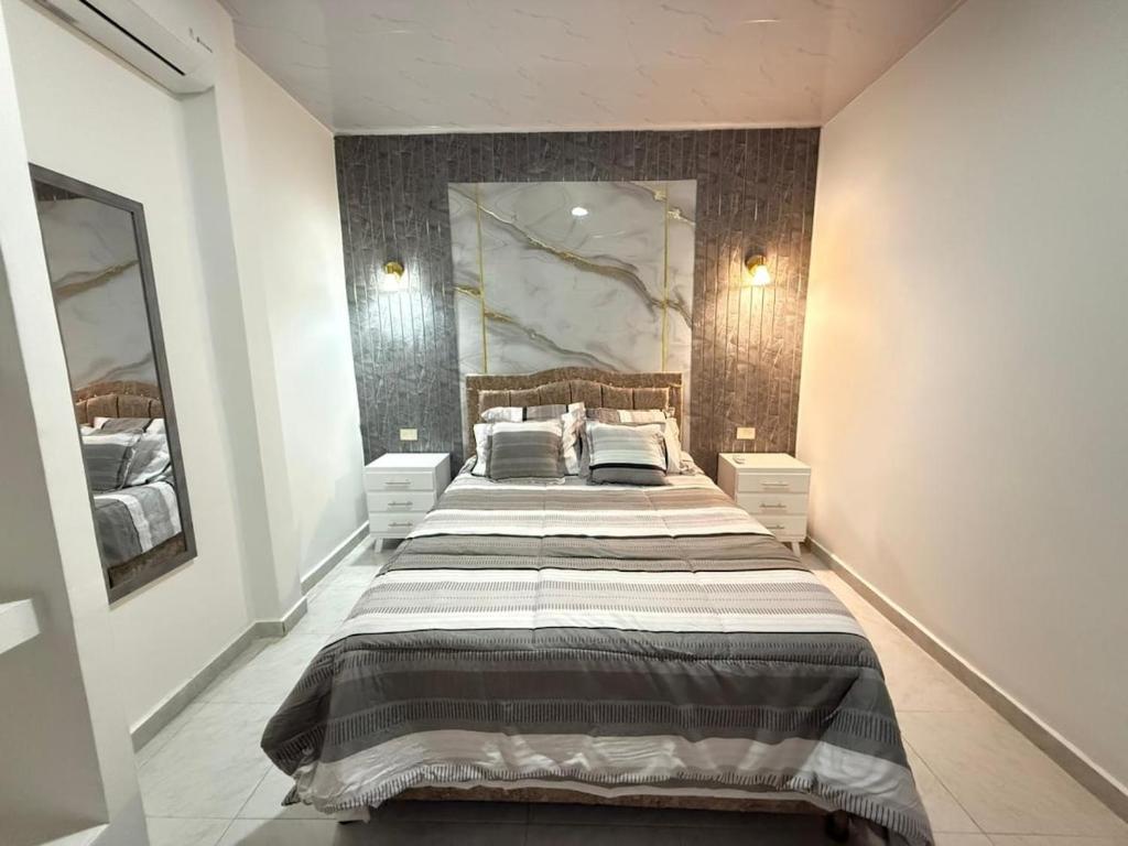 Ένα ή περισσότερα κρεβάτια σε δωμάτιο στο Orinoquía Comfort Suite