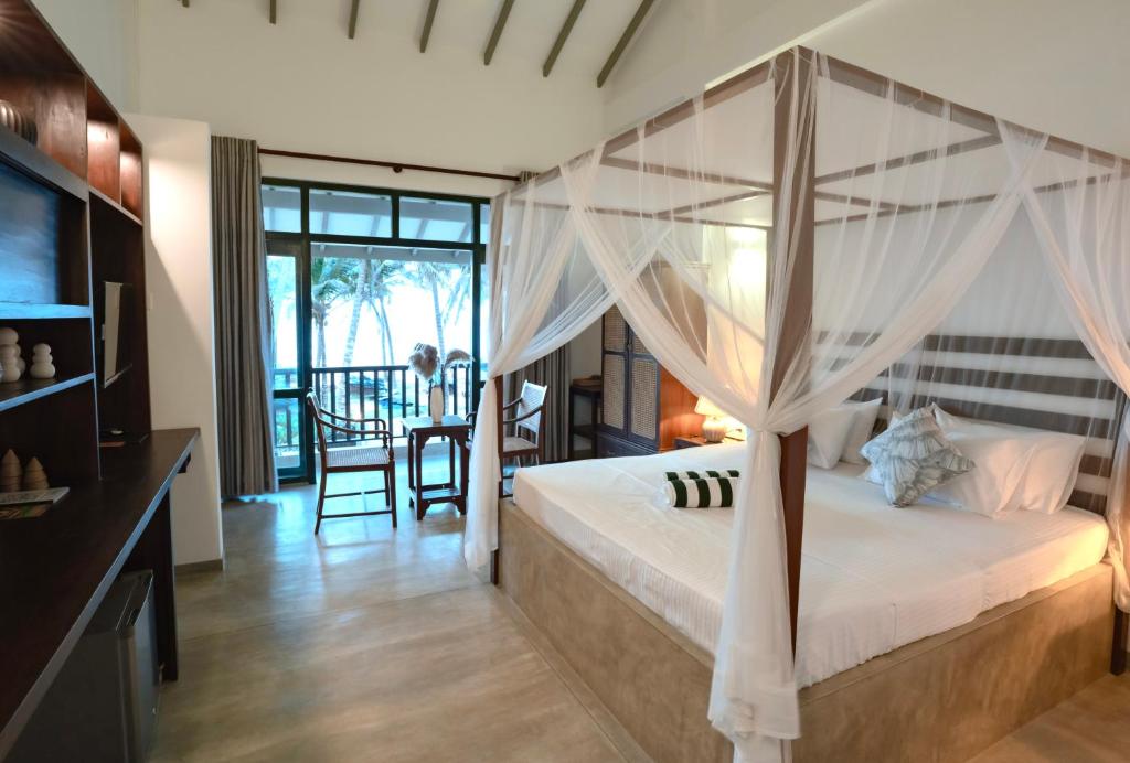 Ένα ή περισσότερα κρεβάτια σε δωμάτιο στο Villa Nilnara