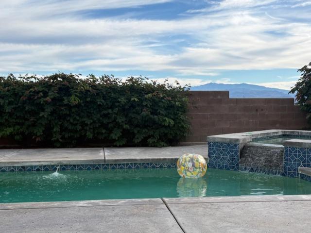 a ball in the water in a swimming pool at Desert Vista View in Desert Hot Springs