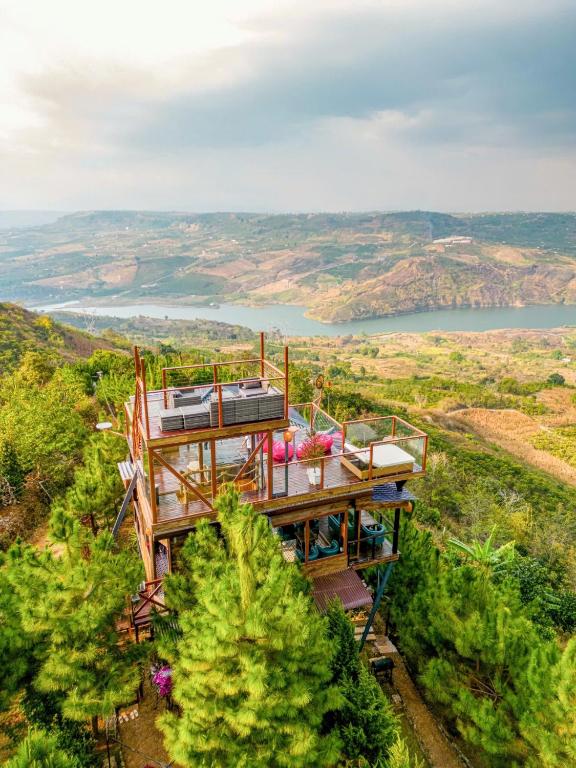 an aerial view of a house on a hill with a view at Hilltop Valley Lâm Đồng in Di Linh