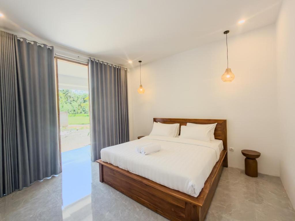 Postel nebo postele na pokoji v ubytování Luz Tropical Homestay