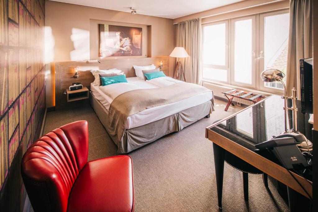 Postel nebo postele na pokoji v ubytování BALTAZÁR Boutique Hotel
