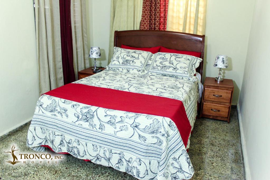 Postel nebo postele na pokoji v ubytování Hotel El Tronco Inc