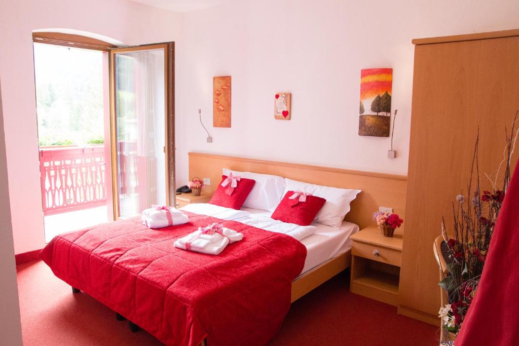Postel nebo postele na pokoji v ubytování GH Hotel Piaz