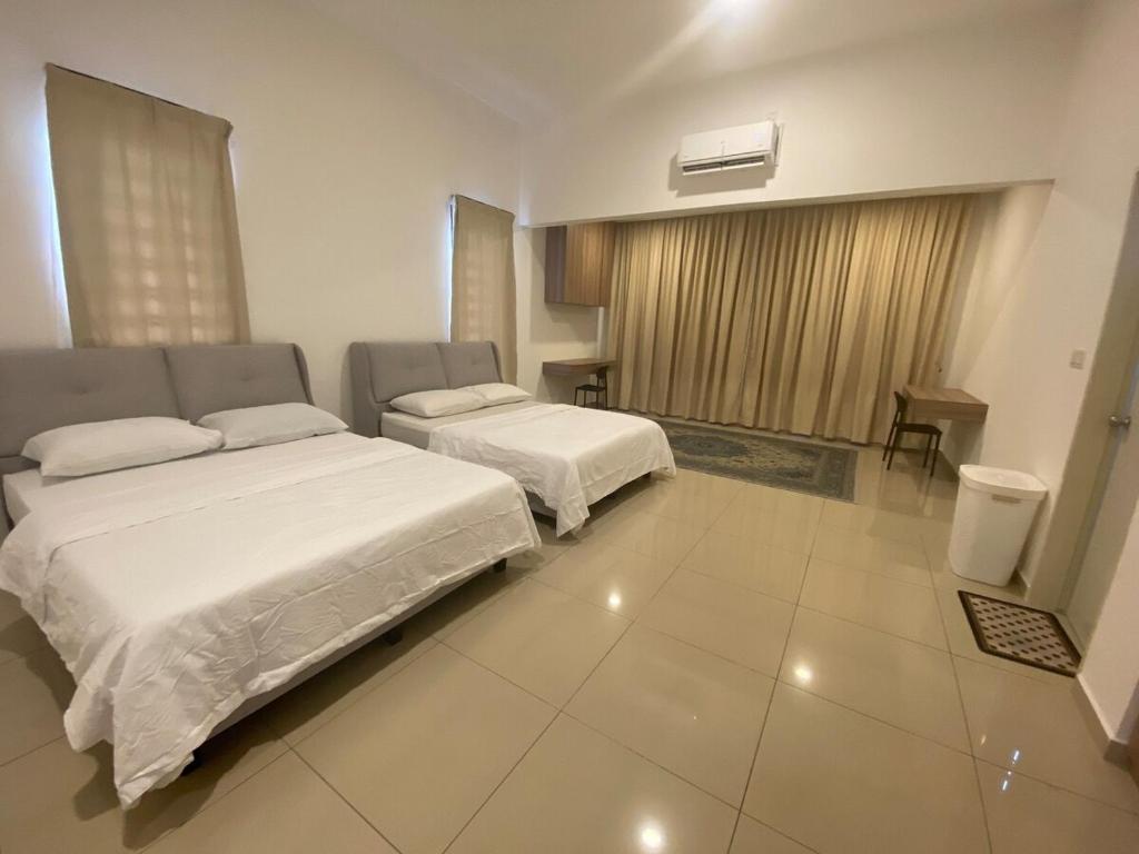 Postel nebo postele na pokoji v ubytování NR Homestay in Kluang