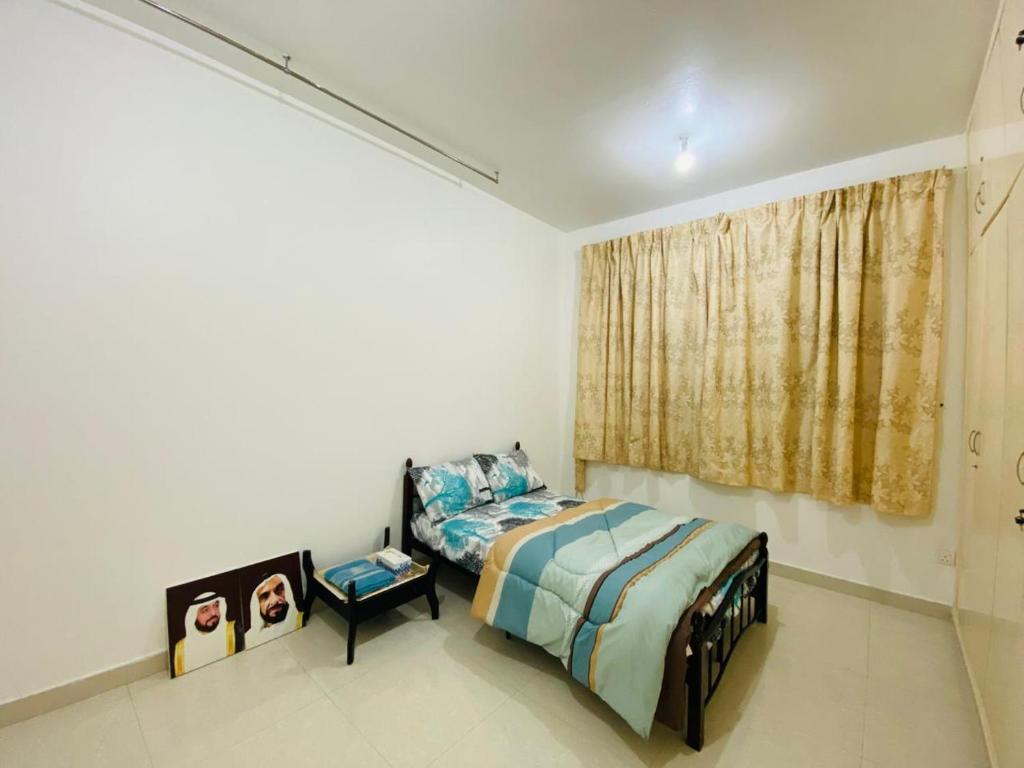 Ένα ή περισσότερα κρεβάτια σε δωμάτιο στο thrifty regular room for 2 to 4