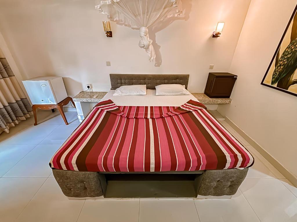 Ένα ή περισσότερα κρεβάτια σε δωμάτιο στο Anu Villa Wadduwa