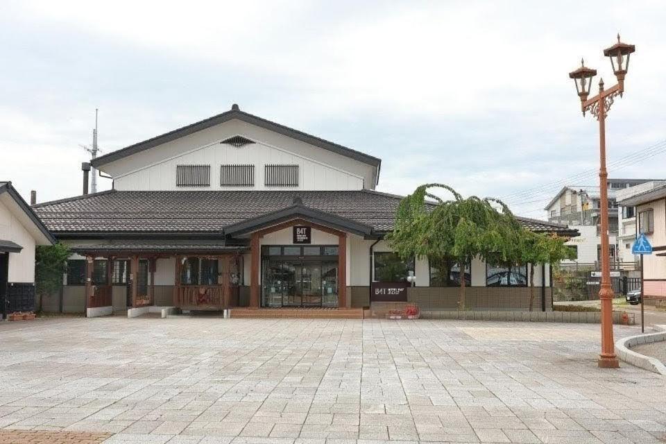 a large building with a lot of windows at Hotel B4T Kakunodate in Senboku