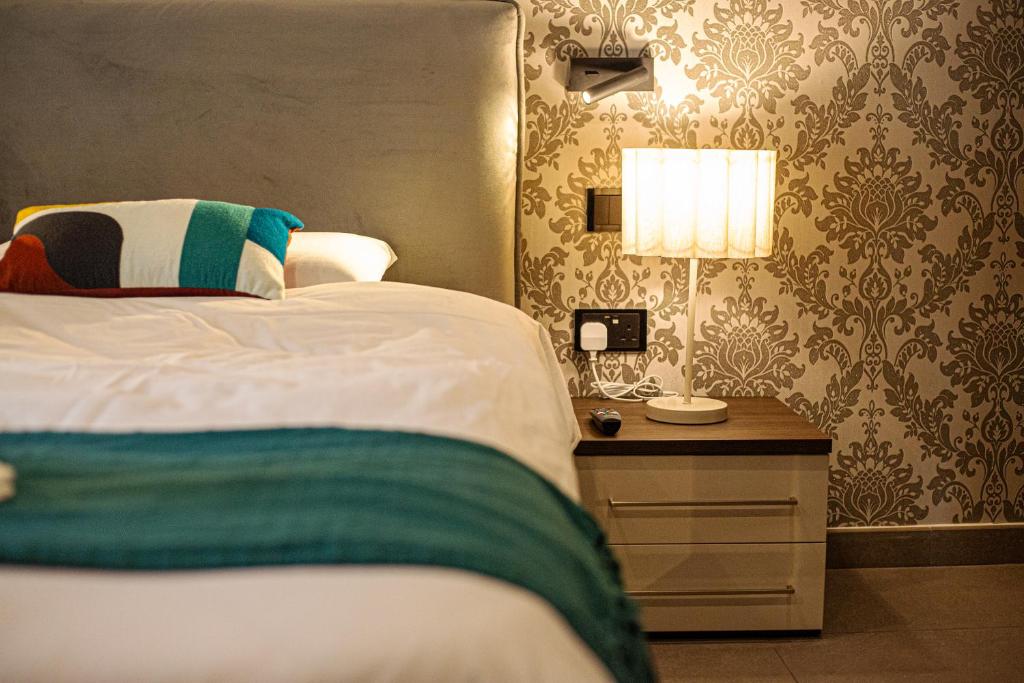 Giường trong phòng chung tại Seabreeze by Matteo