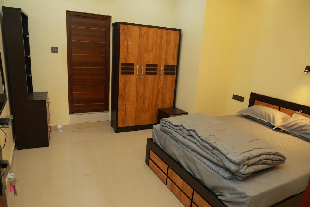 Postel nebo postele na pokoji v ubytování SJ Homes