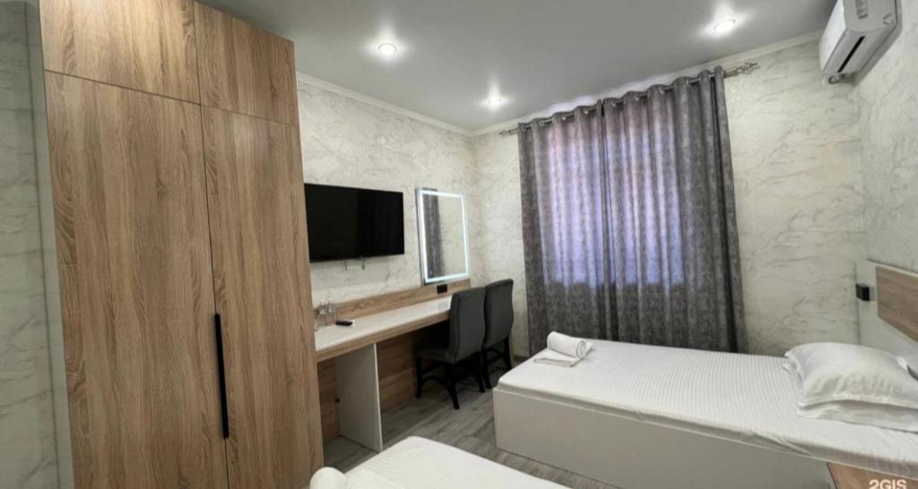 Ένα ή περισσότερα κρεβάτια σε δωμάτιο στο Van park hotel