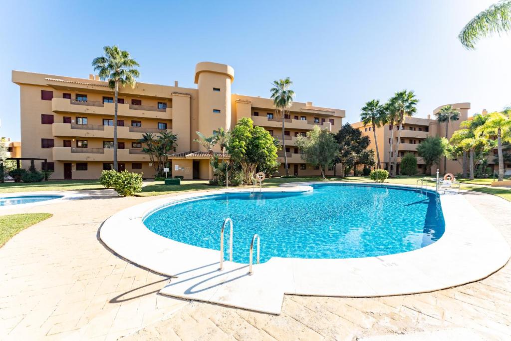 an image of a swimming pool in front of a building at Azul Cala Mijas Apartment in La Cala de Mijas