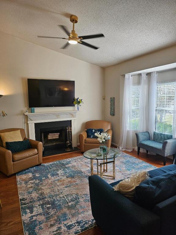 a living room with a couch and a fireplace at Atlanta 3 Bedroom Home - by PriMary EVolution Properties in Atlanta
