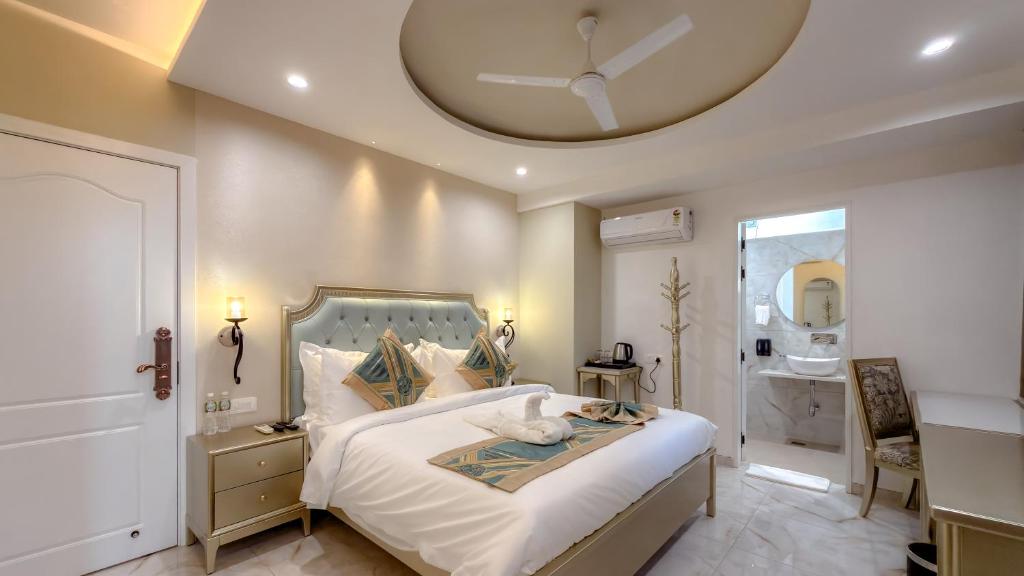 a bedroom with a large bed with a round ceiling at Studio by Jardin in Indore