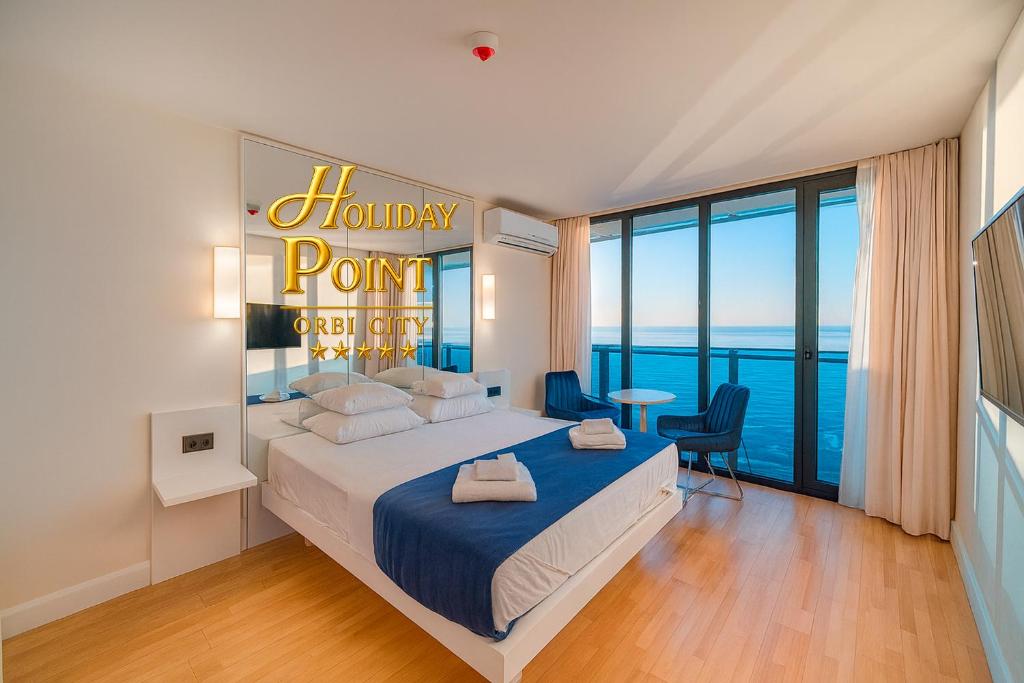 Ένα ή περισσότερα κρεβάτια σε δωμάτιο στο Holiday Point Orbi City