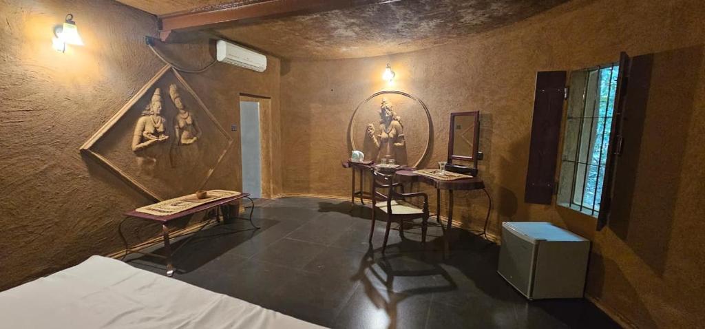 Una cama o camas en una habitación de Sigiriya Wild Cottages