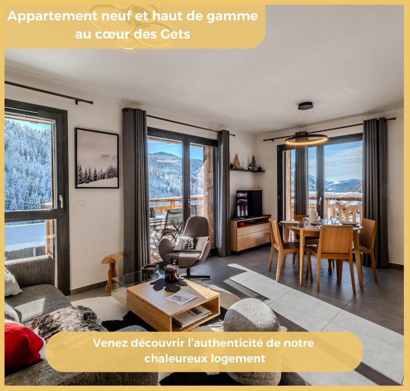 an apartment next to a living room with a table at L'évasion I T3 I Les Gets in Les Gets