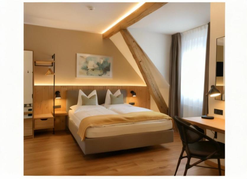 ein Schlafzimmer mit einem großen Bett und einem Schreibtisch mit Schreibtisch in der Unterkunft Hotel Sternen in Gurtnellen