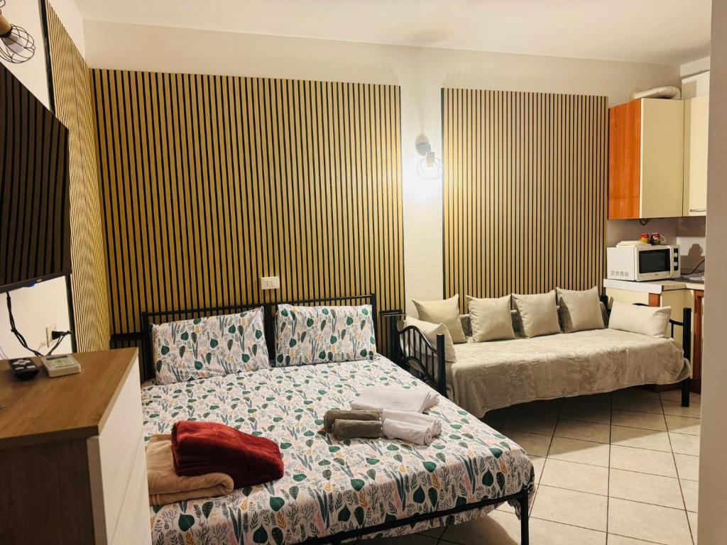 Postel nebo postele na pokoji v ubytování Hello Verona Rooms