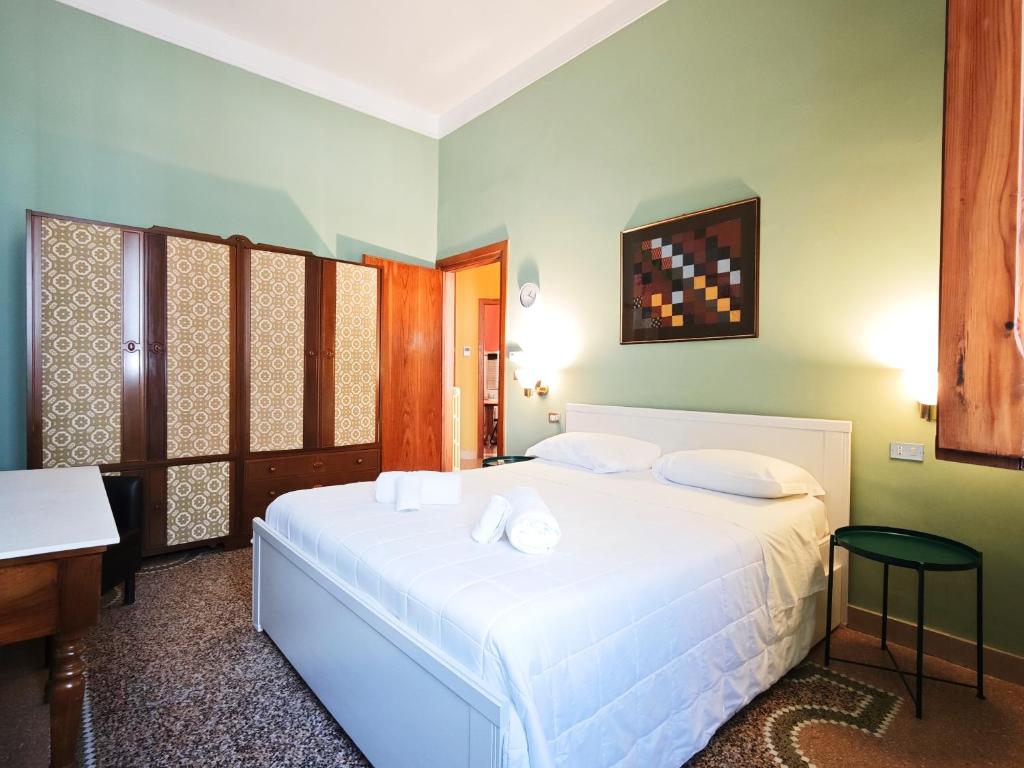 Ένα ή περισσότερα κρεβάτια σε δωμάτιο στο Dimora Cavour