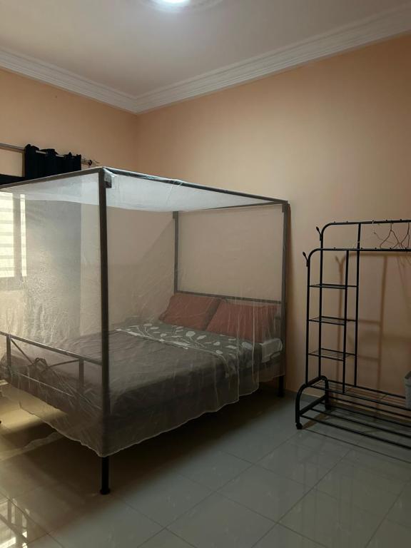 Ένα ή περισσότερα κρεβάτια σε δωμάτιο στο Chambre avec salle de bain privative