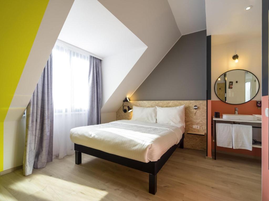 Postel nebo postele na pokoji v ubytování ibis Styles Wien Messe Prater