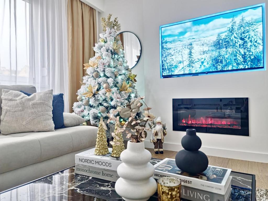 Μια τηλεόραση ή/και κέντρο ψυχαγωγίας στο Linden Avenue Apartment - self check in