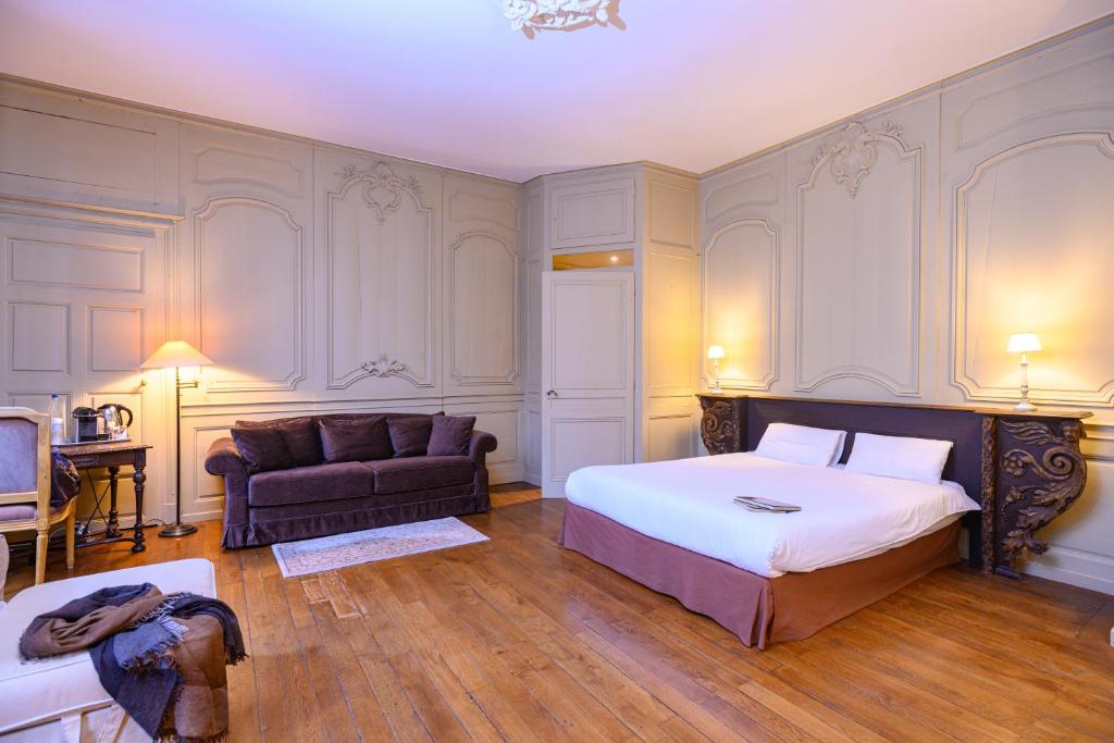 En eller flere senge i et værelse på Résidence Charles Quint