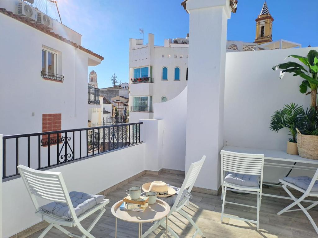 a balcony with a table and chairs and a view at Noctua 012 Estepona Oldtown 3 in Estepona
