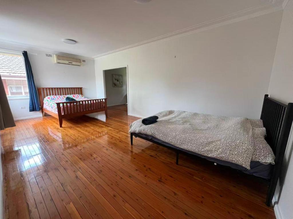 Ένα ή περισσότερα κρεβάτια σε δωμάτιο στο Room 91